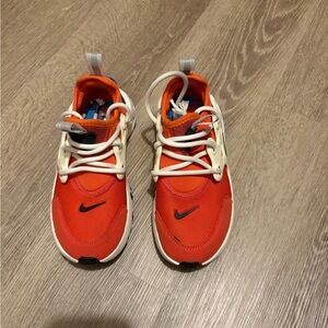 Nike Kids Orange and White Sneaker with Black Swoosh